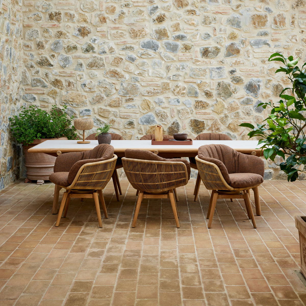Stay Chair by Cane-Line, showing stay chairs in live shot.