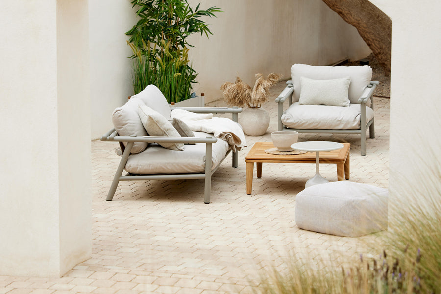 Sticks 2-Seater Sofa by Cane-Line, showing sticks 2-seater sofa in live shot.