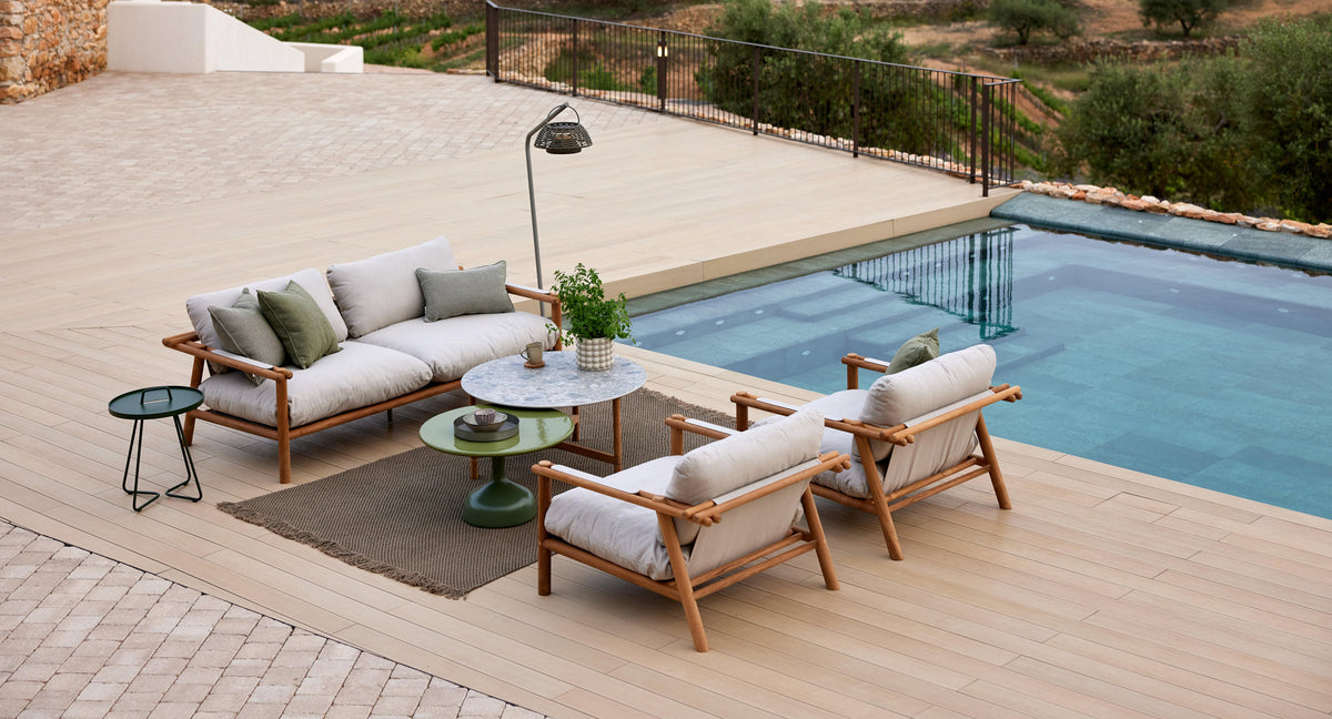Sticks 2-Seater Sofa by Cane-Line, showing sticks 2-seater sofa in live shot.