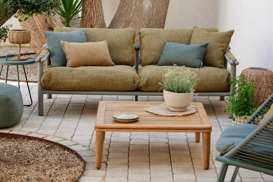 Sticks 2-Seater Sofa by Cane-Line, showing sticks 2-seater sofa in live shot.