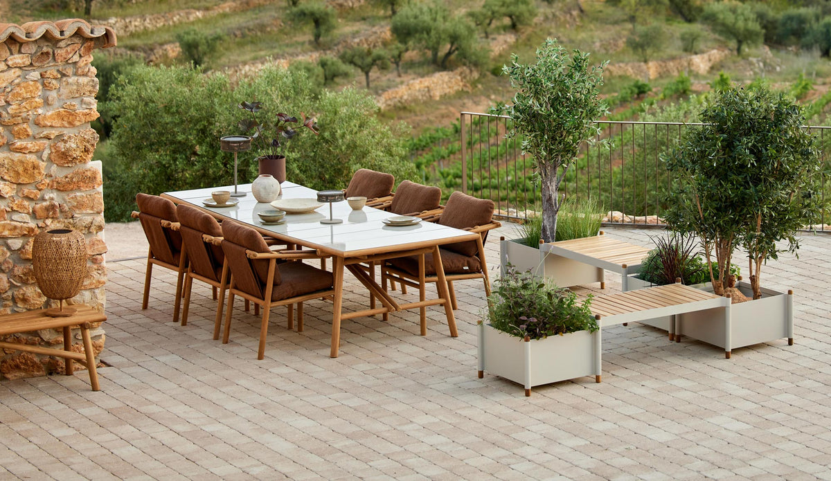 Sticks Armchair by Cane-Line, showing sticks armchairs in live shot.