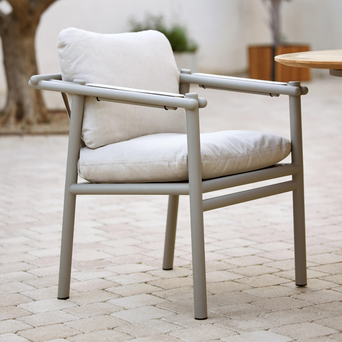 Sticks Armchair by Cane-Line, showing sticks armchair in live shot.