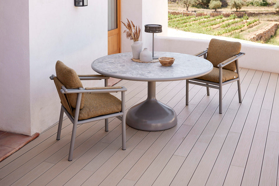 Sticks Armchair by Cane-Line, showing sticks armchairs in live shot.