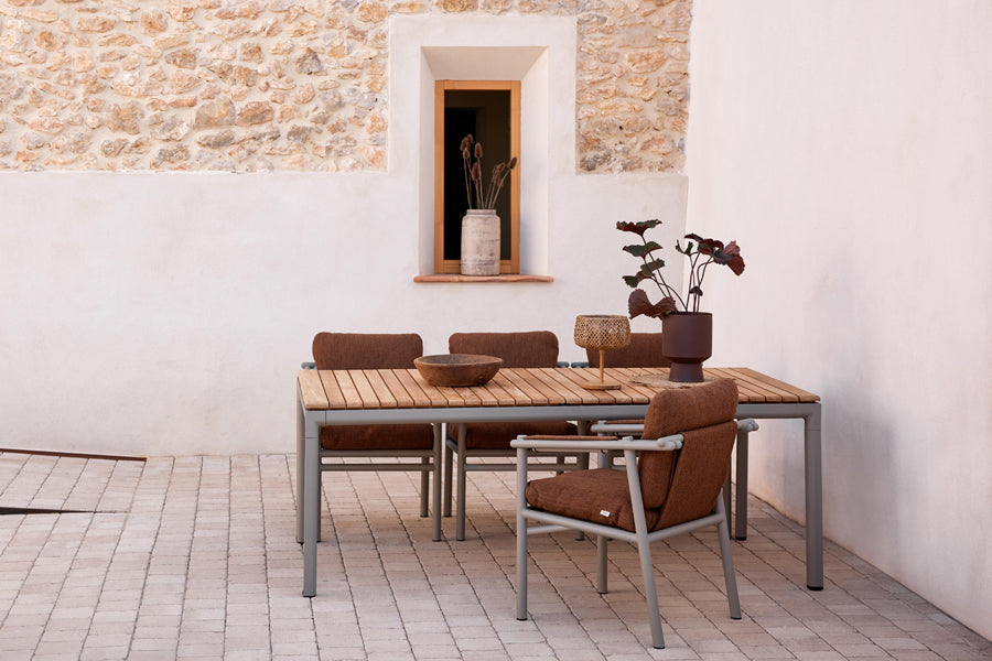 Sticks Armchair by Cane-Line, showing sticks armchairs in live shot.