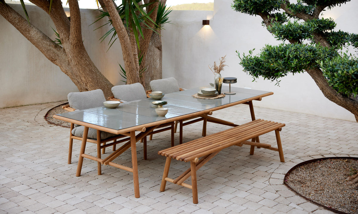 Sticks Bench by Cane-Line, showing sticks bench in live shot.