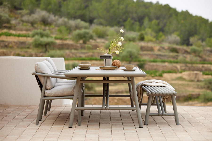 Sticks Dining Table by Cane-Line, showing sticks dining table in live shot.
