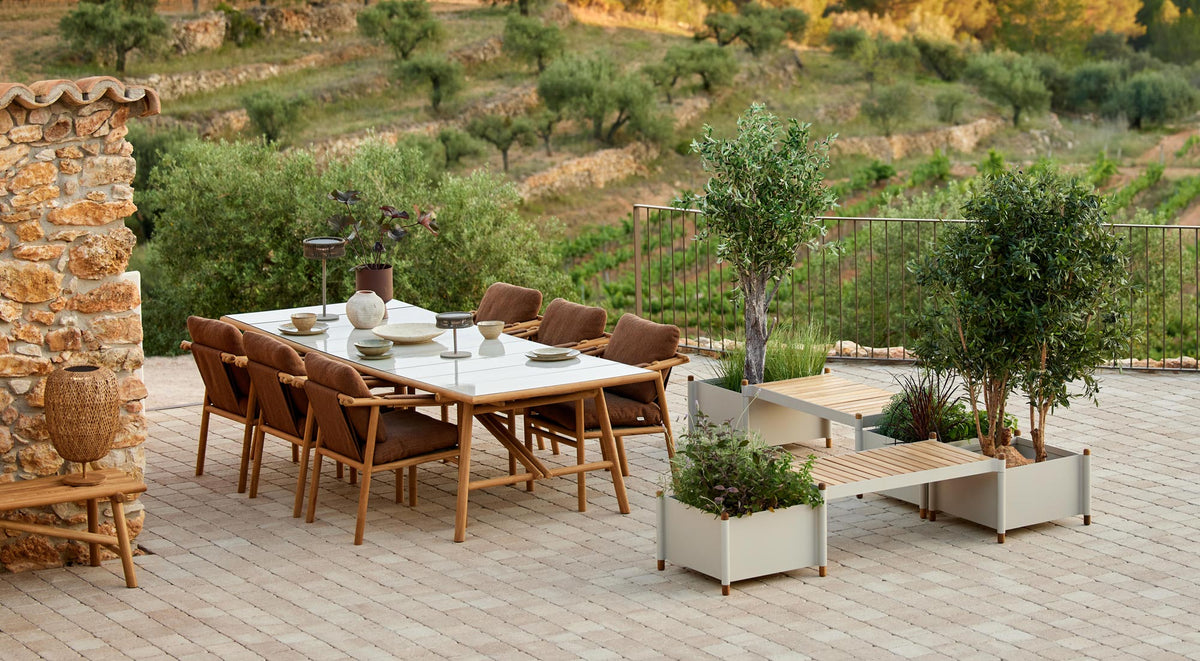 Sticks Dining Table by Cane-Line, showing sticks dining table in live shot.
