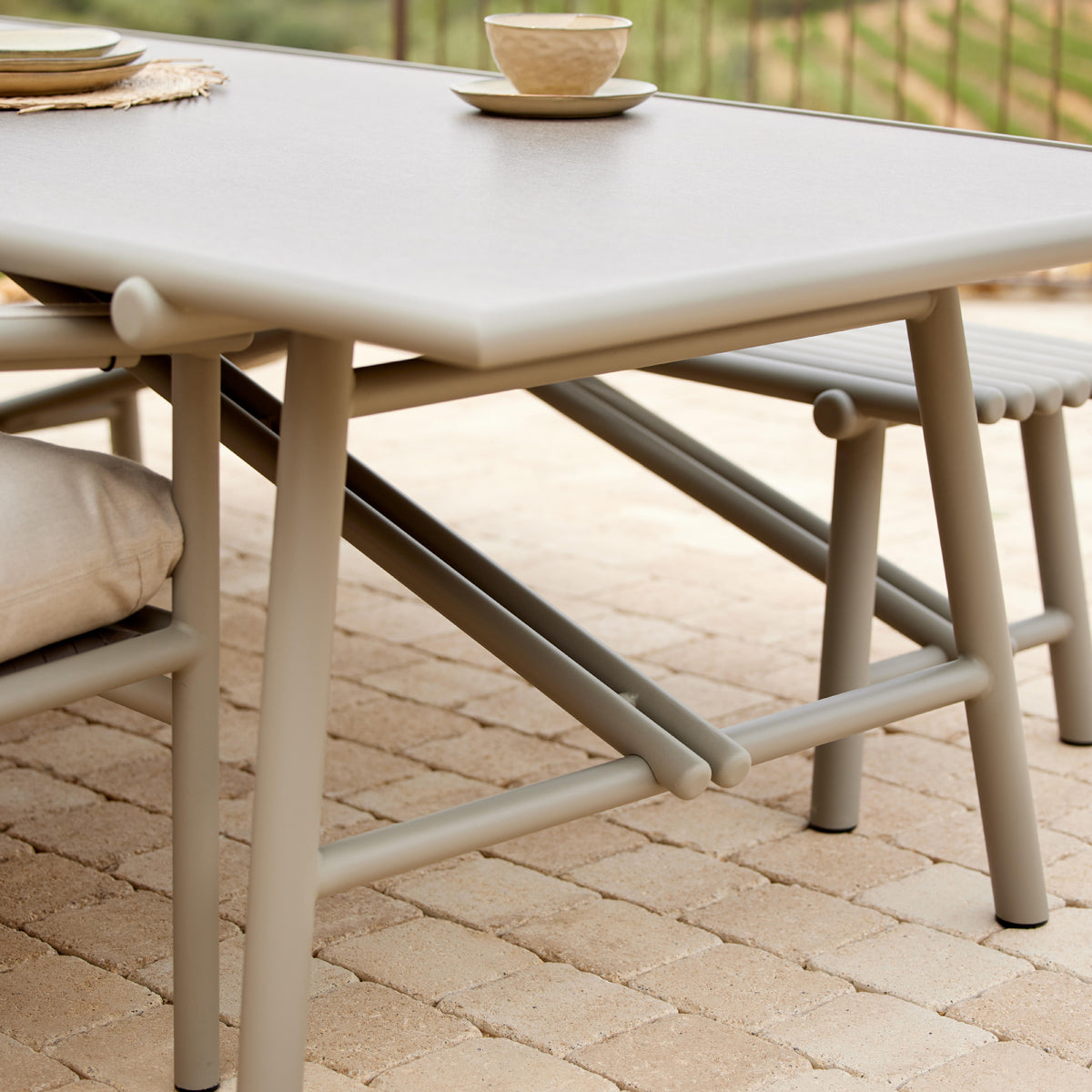 Sticks Dining Table by Cane-Line, showing closeup view of sticks dining table in live shot.