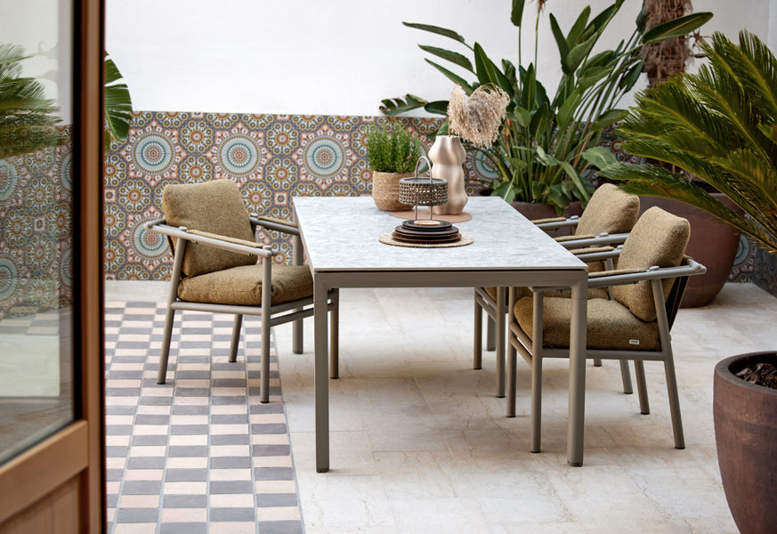 Sticks Dining Table by Cane-Line, showing sticks dining table in live shot.