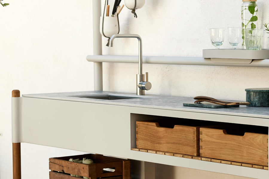 Sticks Kitchen Module with Teak Shelf by Cane-Line, showing closeup view of sticks kitchen module with teak shelf in live shot.