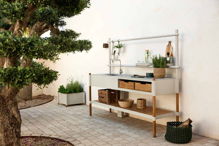 Sticks Kitchen Module with Teak Shelf by Cane-Line, showing sticks kitchen module with teak shelf in live shot.