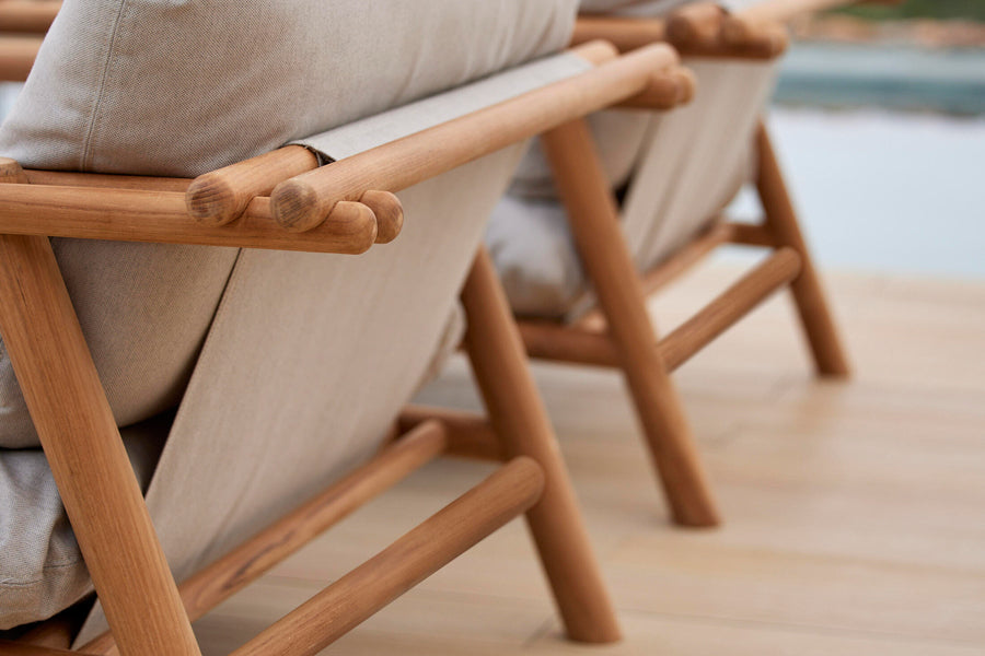 Sticks Lounge Chair by Cane-Line, showing closeup view of sticks lounge chairs in live shot.