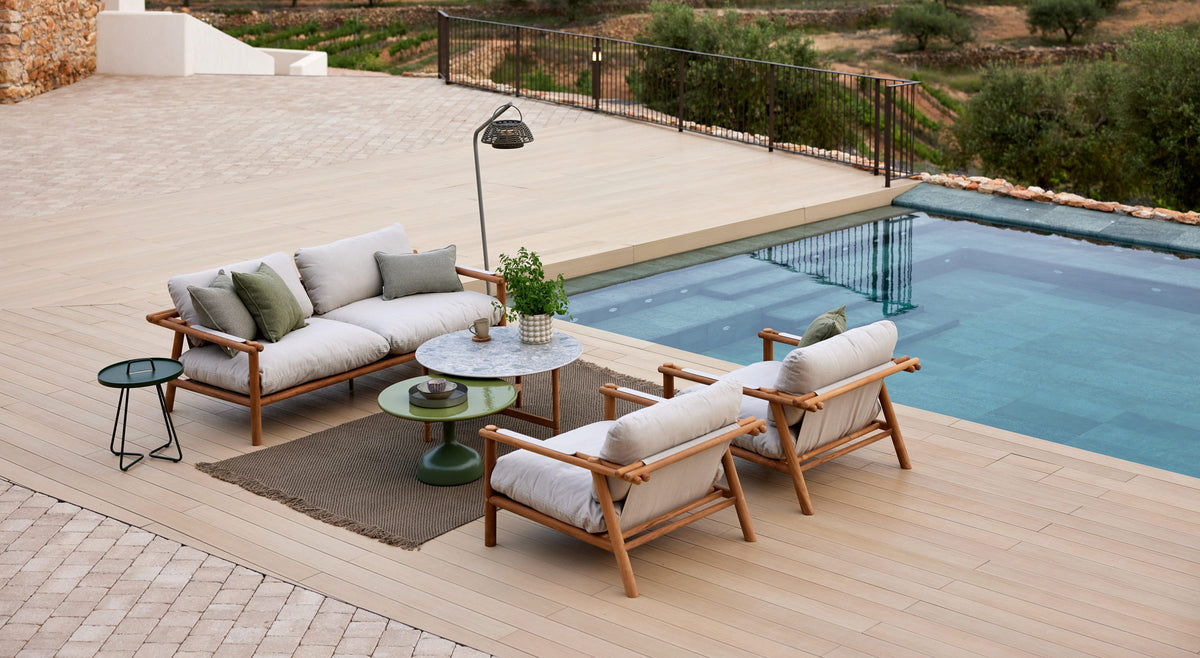 Sticks Lounge Chair by Cane-Line, showing sticks lounge chairs in live shot.