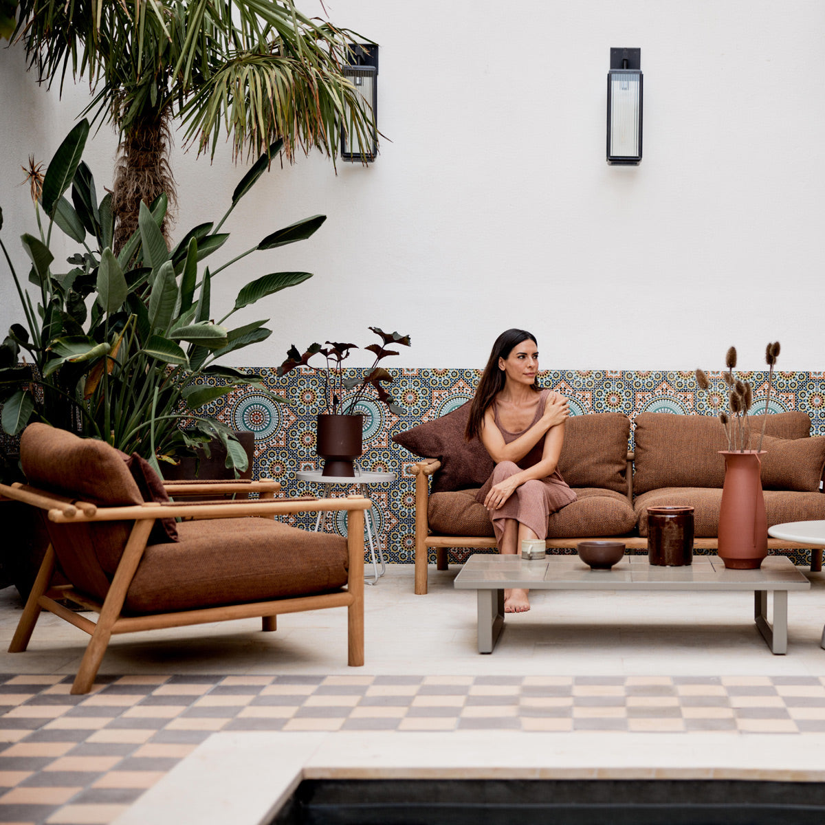 Sticks Lounge Chair by Cane-Line, showing sticks lounge chair in live shot.