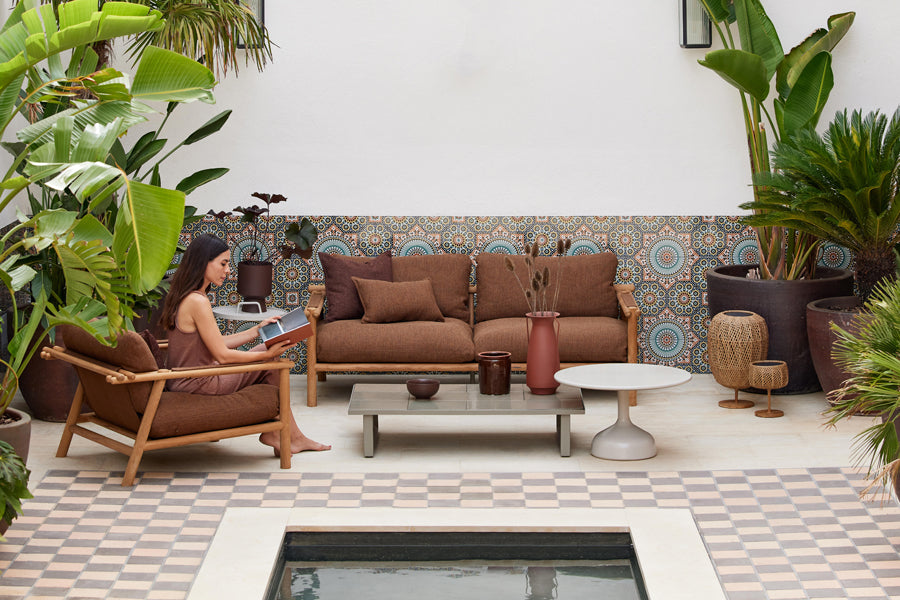 Sticks Lounge Chair by Cane-Line, showing sticks lounge chair in live shot.
