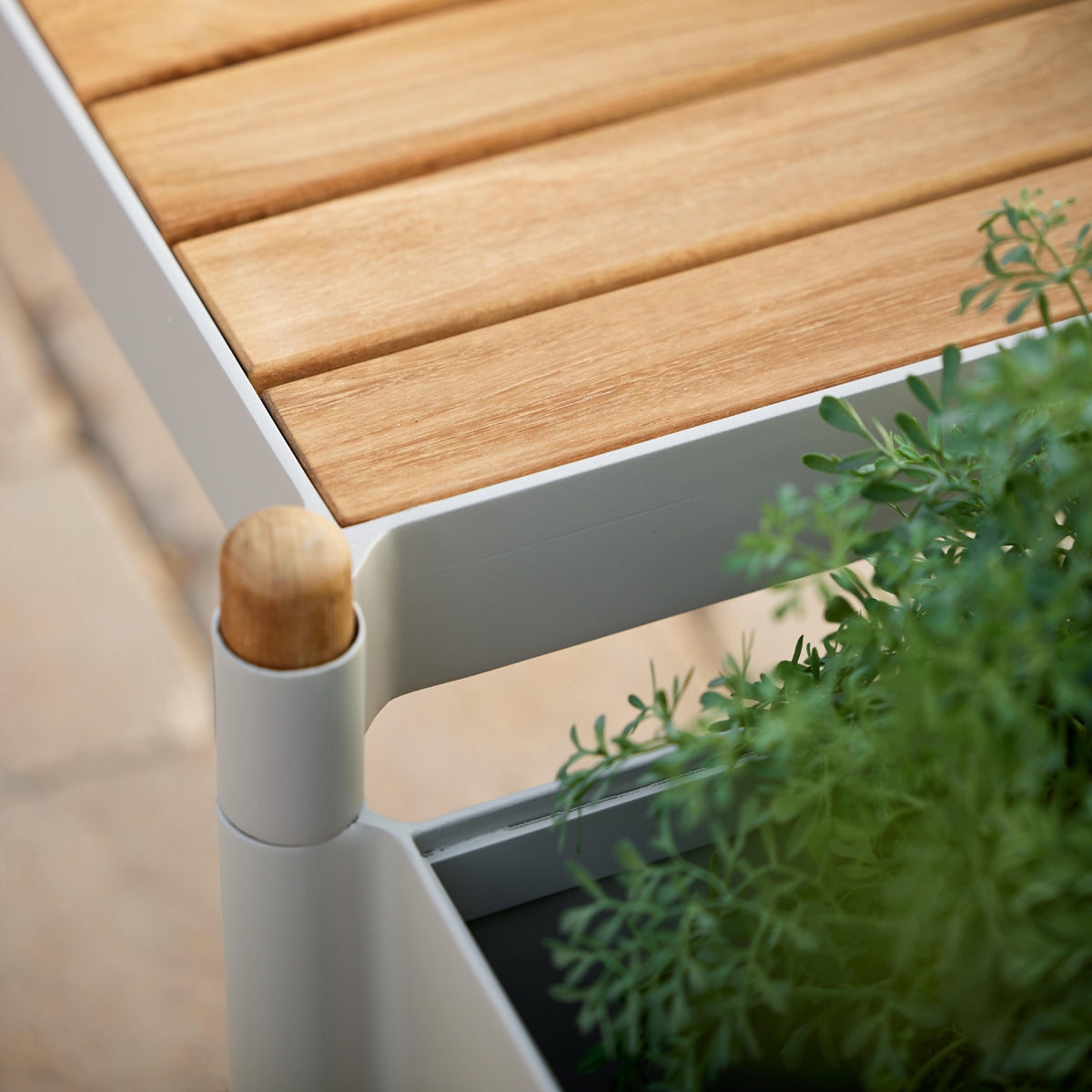 Sticks Planter by Cane-Line, showing closeup view of sticks planter in live shot.