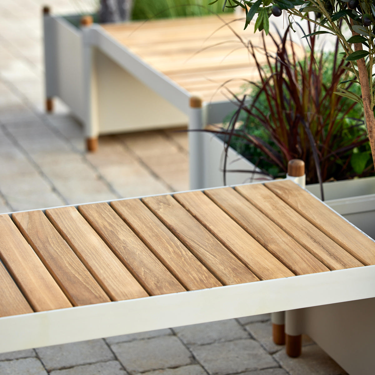 Sticks Planter by Cane-Line, showing closeup view of sticks planters in live shot.