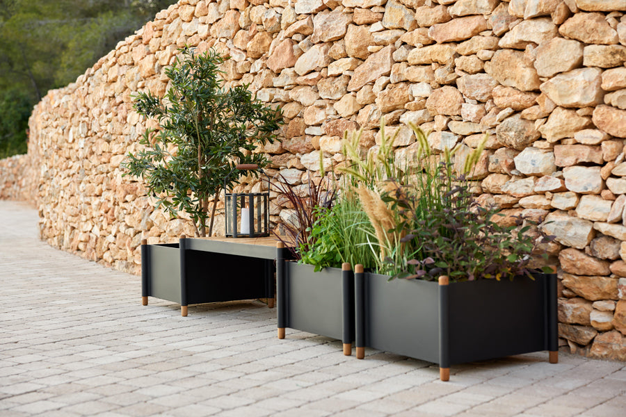Sticks Planter by Cane-Line, showing sticks planters in live shot.