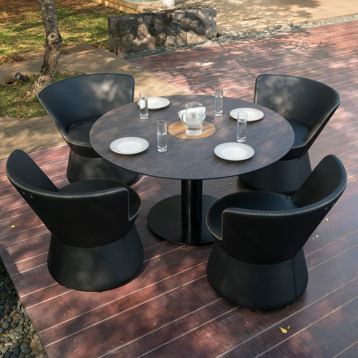 Stizzy Large Pedestal Dining Table by Mamagreen, showing stizzy large pedestal dining table in live shot.