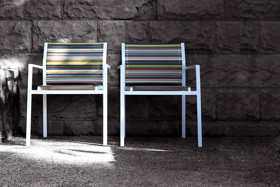 Stripe Stackable Armchair by Mamagreen, showing stripe stackable armchairs in live shot.