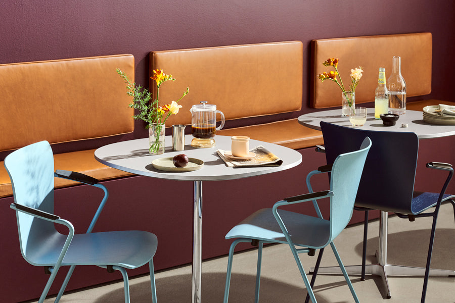 Supercircular Table by Fritz Hansen, showing supercircular tables in live shot.