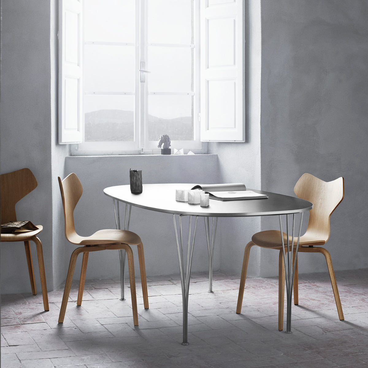 Superellipse Table by Fritz Hansen, showing superellipse table in live shot.