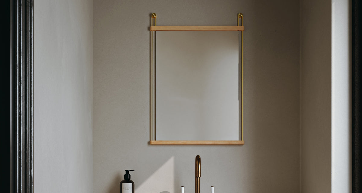 Suspended Mirror by Woud, showing suspended mirror in live shot.