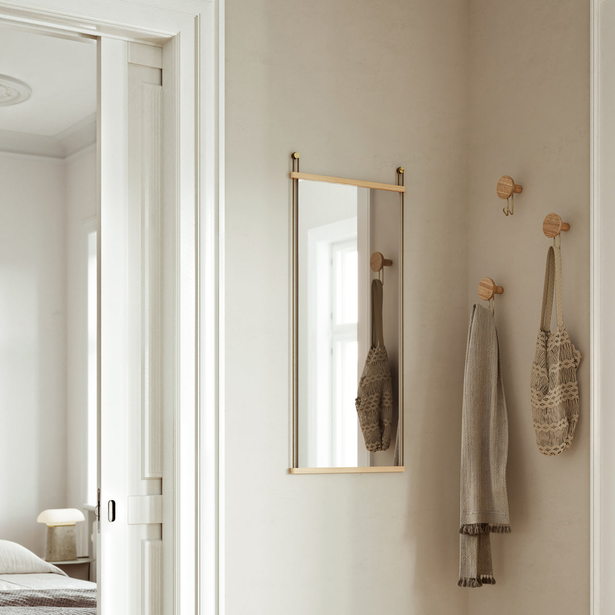 Suspended Mirror by Woud, showing suspended mirror in live shot.