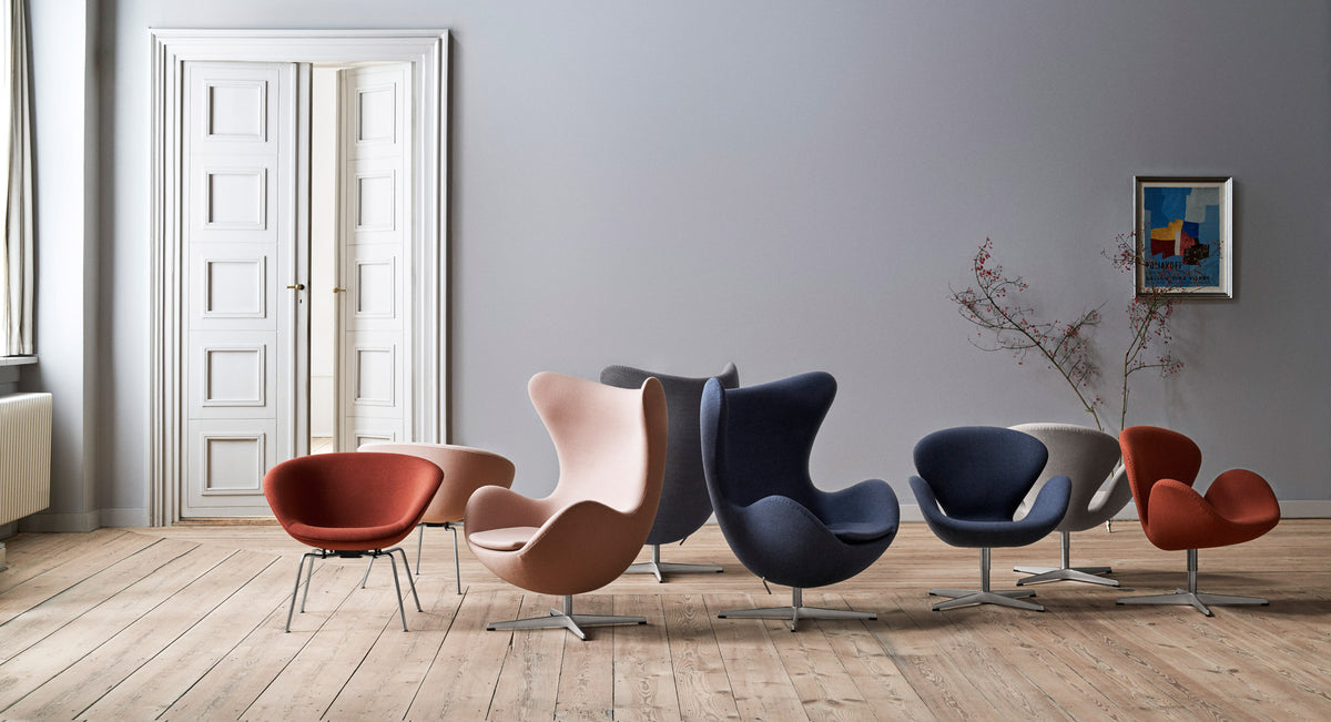 Swan Lounge Swivel Chair by Fritz Hansen, showing swan lounge swivel chairs in live shot.