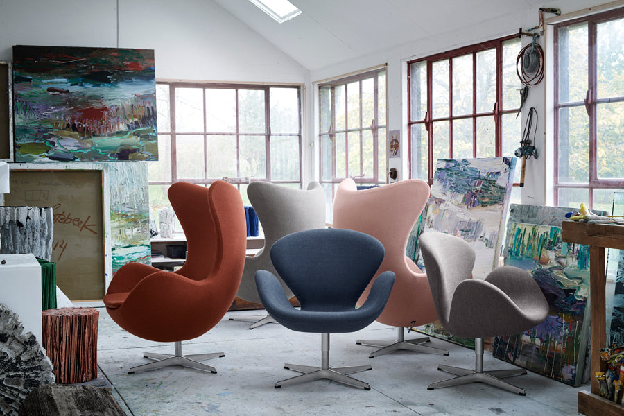 Swan Lounge Swivel Chair by Fritz Hansen, showing swan lounge swivel chairs in live shot.