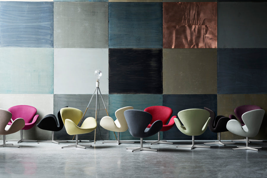 Swan Lounge Swivel Chair by Fritz Hansen, showing swan lounge swivel chairs in live shot.