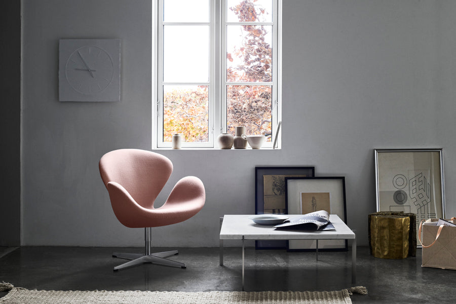 Swan Lounge Swivel Chair by Fritz Hansen, showing swan lounge swivel chair in live shot.