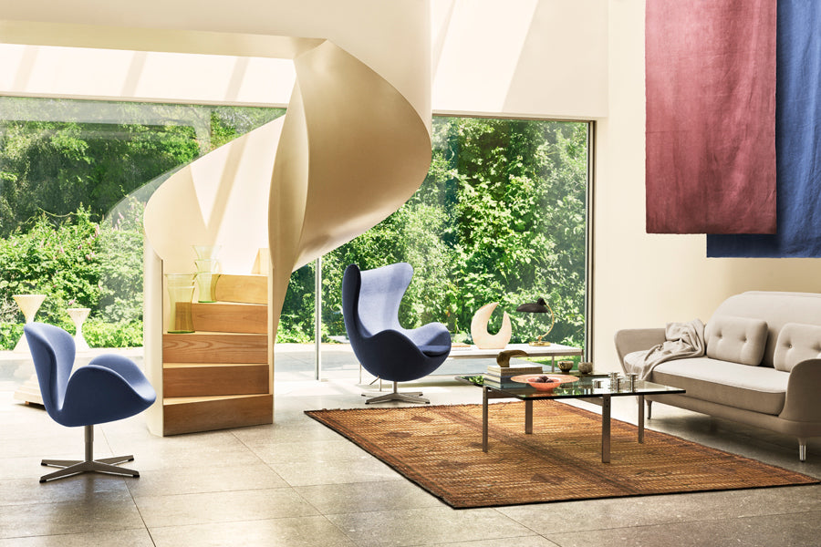Swan Lounge Swivel Chair by Fritz Hansen, showing swan lounge swivel chair in live shot.