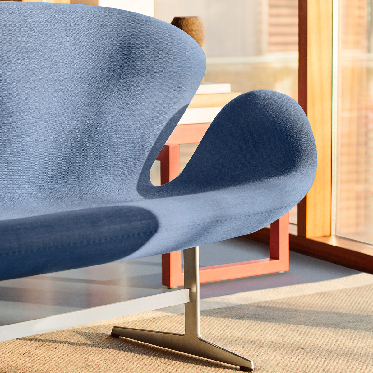 Swan Sofa by Fritz Hansen, showing closeup view of swan sofa in live shot.