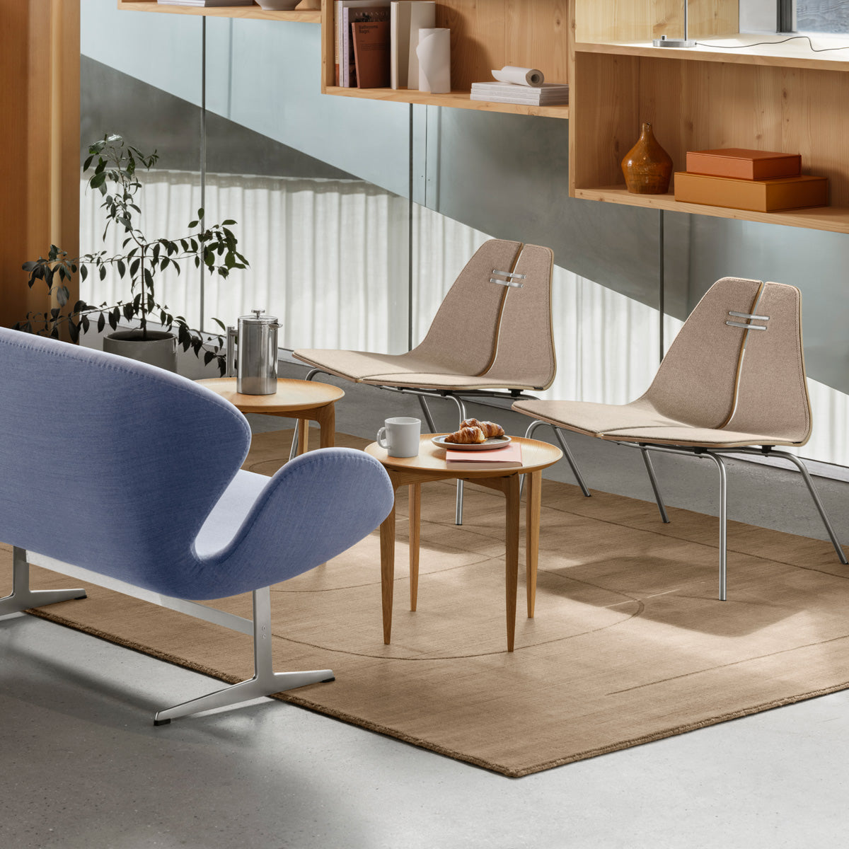 Swan Sofa by Fritz Hansen, showing closeup view of swan sofa in live shot.