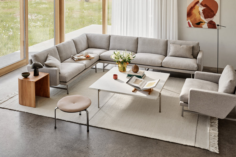 Taburet Stool/Side Table by Fritz Hansen, showing taburet stool/side table in live shot.