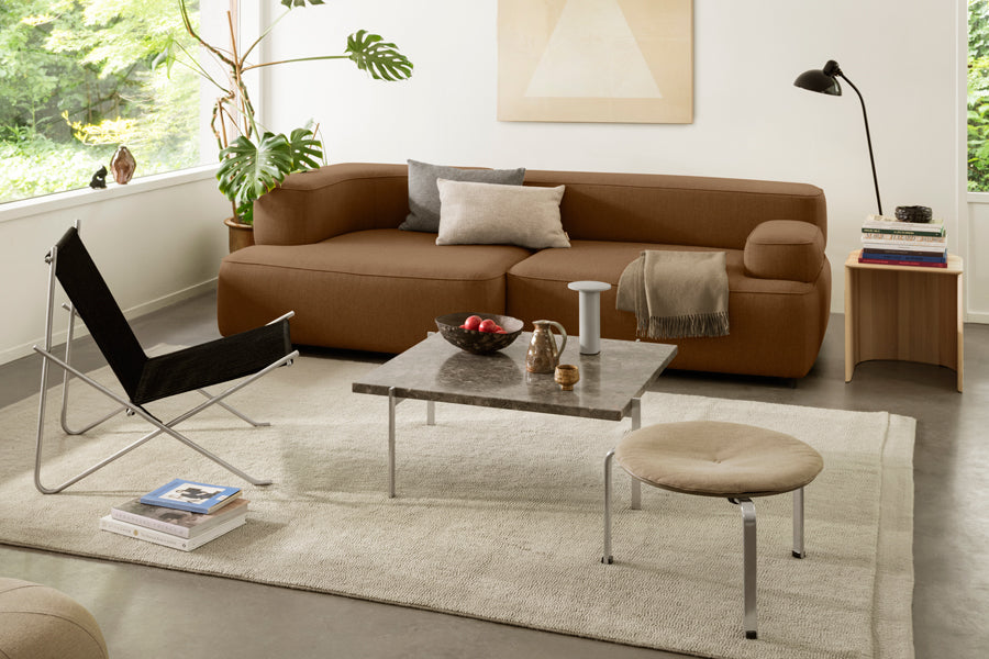Taburet Stool/Side Table by Fritz Hansen, showing taburet stool/side table in live shot.