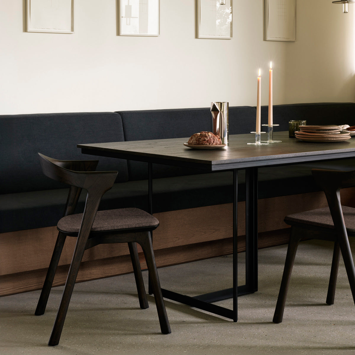 Tacet Dining Table by Ethnicraft, showing closeup view of tacet dining table in live shot.