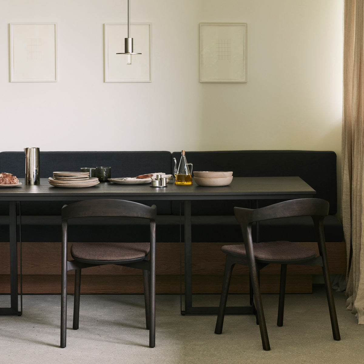 Tacet Dining Table by Ethnicraft, showing closeup view of tacet dining table in live shot.