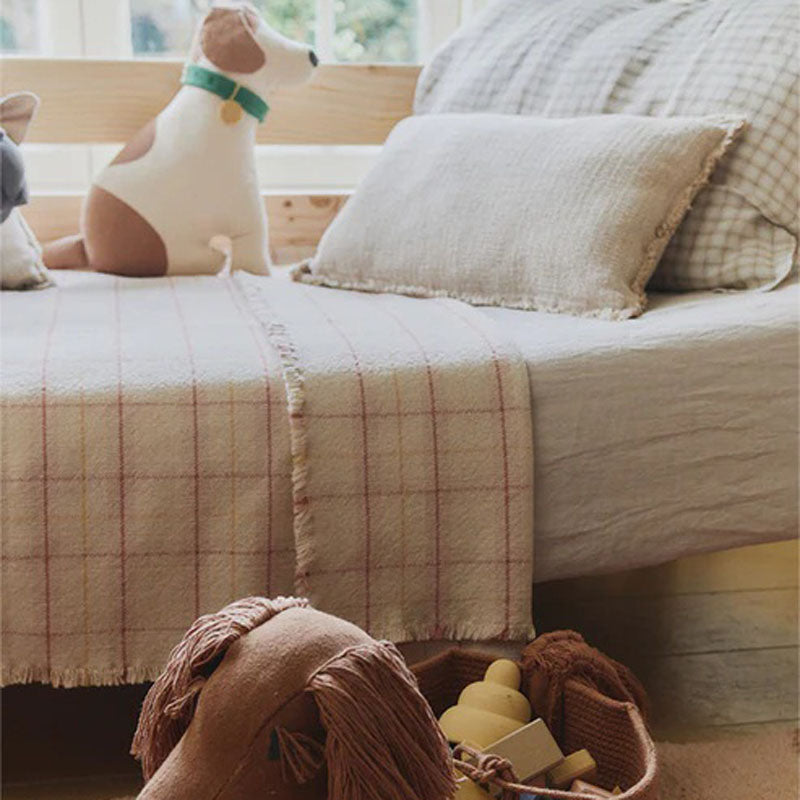 Tartan Handloom Kid Bed Throw by Lorena Canals, showing tartan handloom kid bed throw in live shot.