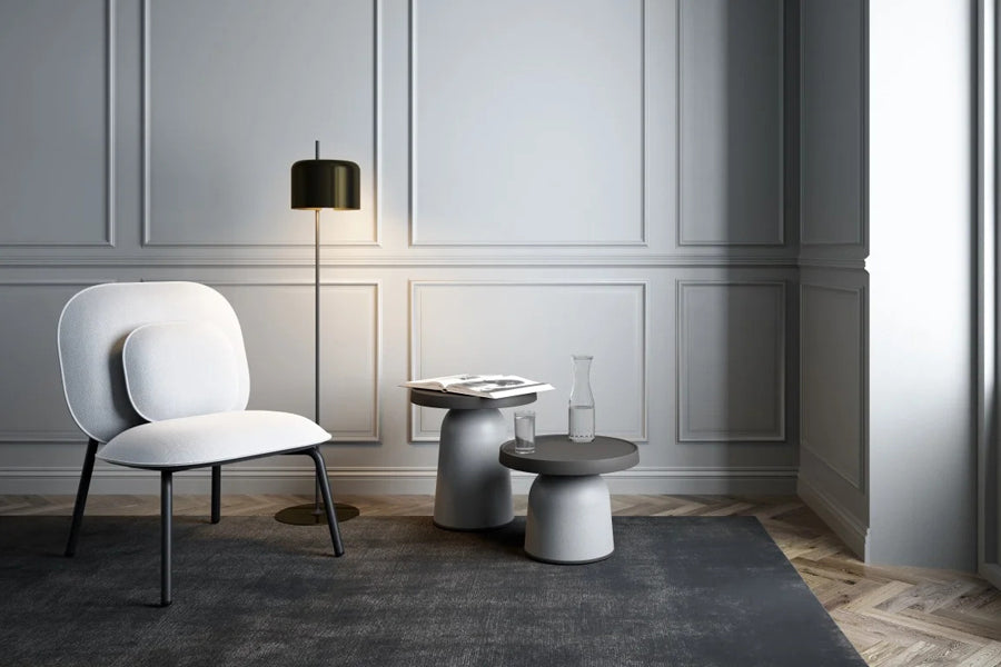 Tasca Pillow by Toou, showing tasca pillow with lounge chair in live shot.