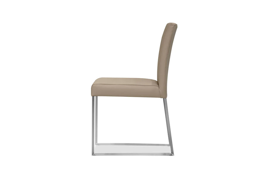 Tate Dining Chair by Mobital, showing side view of tate dining chair in wheat leather/brushed steel legs.