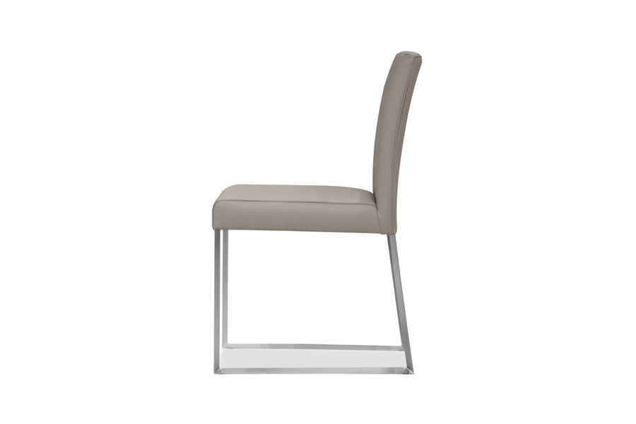 Tate Dining Chair by Mobital, showing side view of tate dining chair in pewter leather/brushed steel legs.