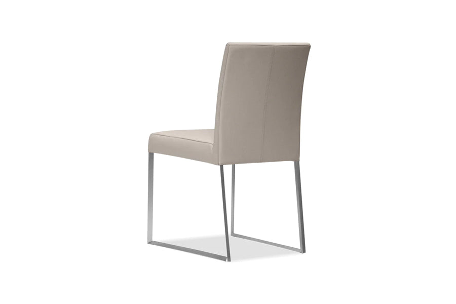 Tate Dining Chair by Mobital, showing angle view of tate dining chair in pewter leather/brushed steel legs.