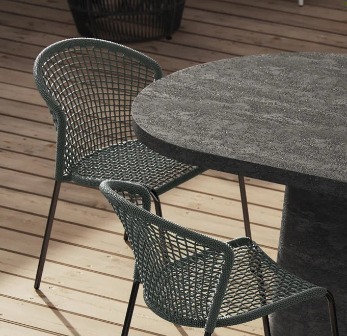 Tavik Outdoor Dining Chair by Viesso, showing tavik outdoor dining chairs in live shot.