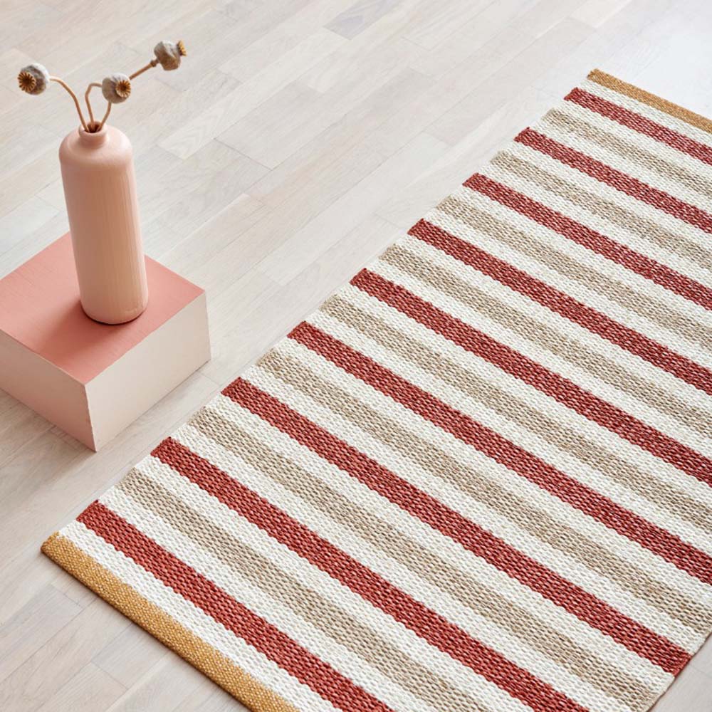 Teo Brick & Beige with Vanilla Rug by Pappelina, showin teo brick & beige with vanilla rug in live shot.