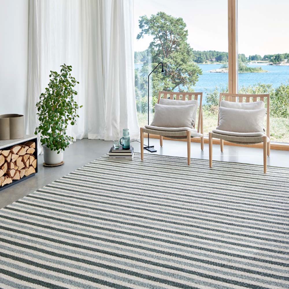 Teo Sage & Army with Vanilla Rug by Pappelina, showing teo sage & army with vanilla rug in live shot.