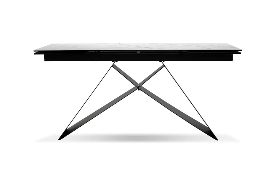 The W Extending Dining Table by Mobital, showing front view of the w extending dining table in carrara white ceramic tempered glass top/black powder coated base.
