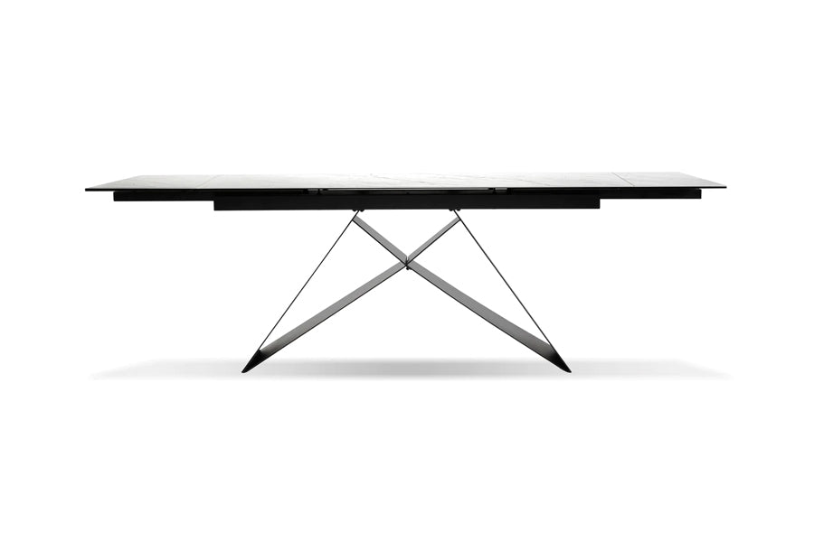 The W Extending Dining Table by Mobital, showing front view of the w extending dining table in carrara white ceramic tempered glass top/black powder coated base.