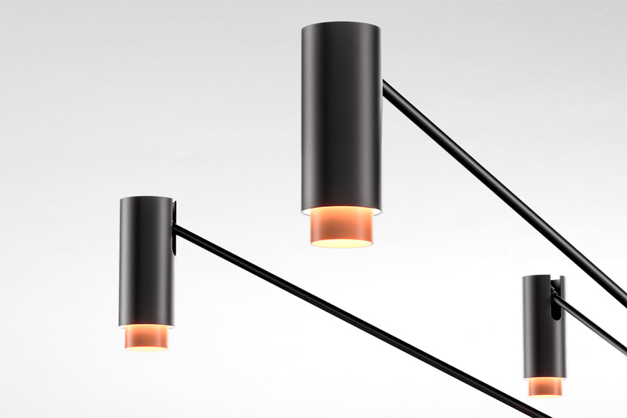 The W Pendant by Marset, showing closeup view of the w pendant in studio shot.